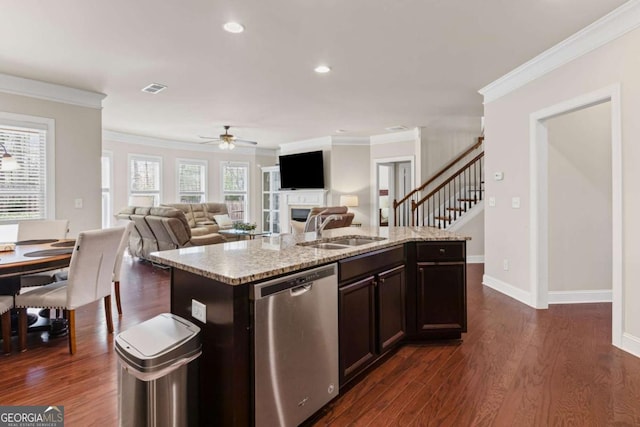 kitchen featuring dark wood-style floors, visible vents, ceiling fan, stainless steel dishwasher, and a sink