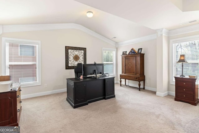 office featuring a wealth of natural light, visible vents, light colored carpet, and lofted ceiling