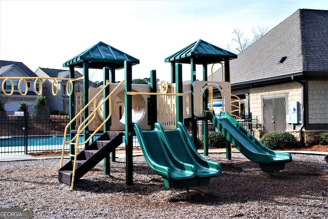 community jungle gym with fence