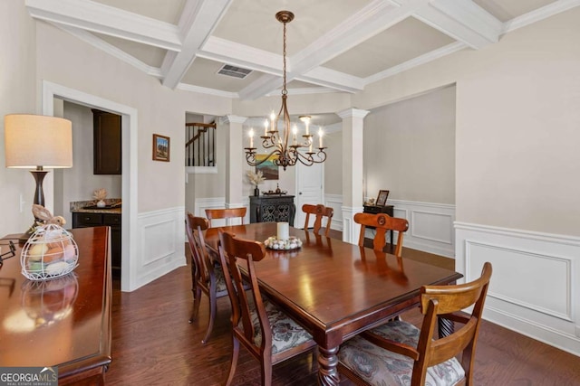 dining area featuring ornate columns, beamed ceiling, a notable chandelier, and dark wood-style flooring