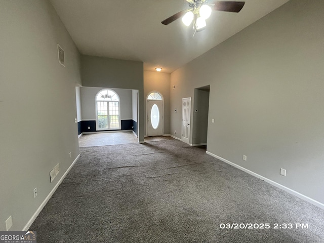 135 Flowers Dr, Covington, GA 30016 - entrance foyer featuring carpet flooring, visible vents, baseboards, and ceiling fan