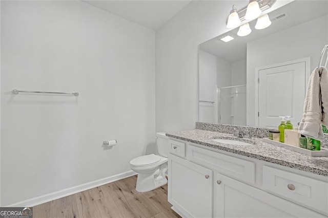 kitchen featuring white cabinets, stainless steel appliances, a sink, decorative backsplash, and a kitchen island with sink