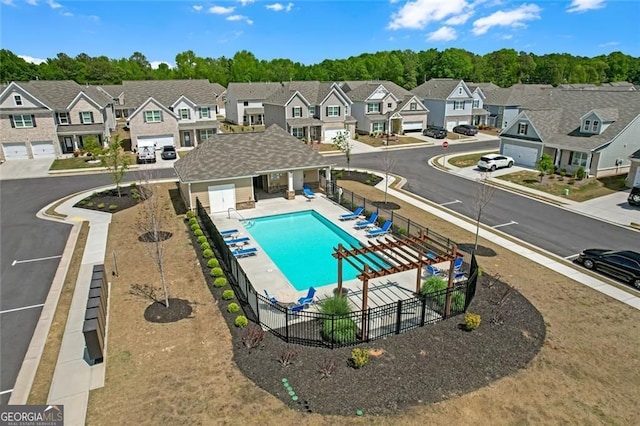 birds eye view of property featuring a residential view and a forest view