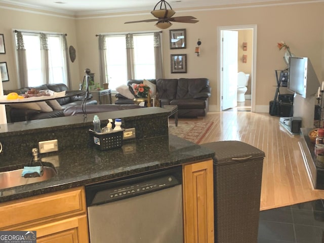 6279 Giles Rd, Lithonia, GA 30058 - kitchen featuring open floor plan, stainless steel dishwasher, ornamental molding, a ceiling fan, and brown cabinets