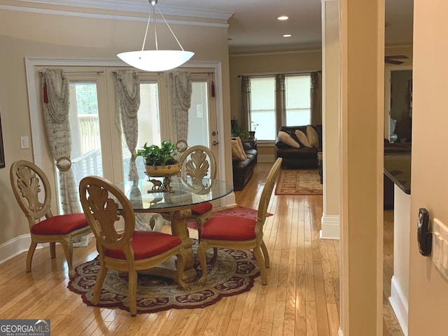 6279 Giles Rd, Lithonia, GA 30058 - dining space with light wood-style flooring and ornamental molding