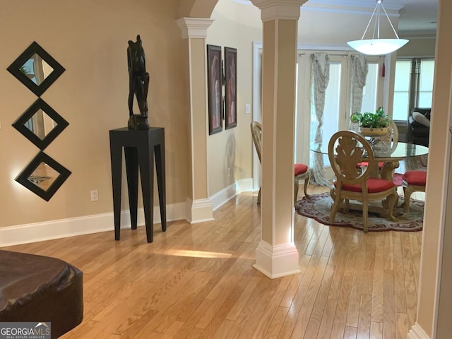 6279 Giles Rd, Lithonia, GA 30058 - hallway with decorative columns and light wood-style floors