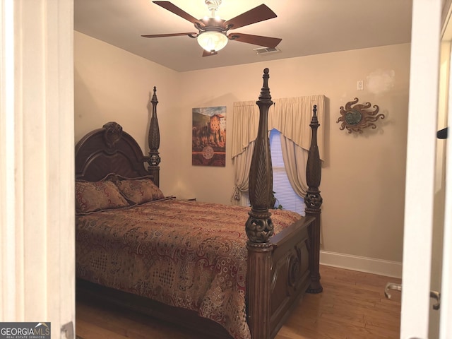 6279 Giles Rd, Lithonia, GA 30058 - bedroom featuring wood finished floors and a ceiling fan