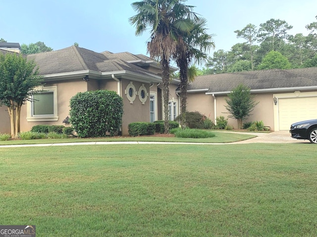 6279 Giles Rd, Lithonia, GA 30058 - ranch-style house featuring stucco siding, a front lawn, and a garage