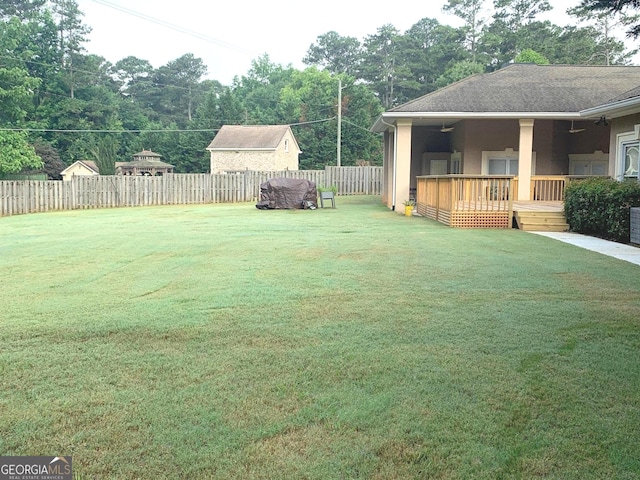 6279 Giles Rd, Lithonia, GA 30058 - fenced backyard featuring a deck