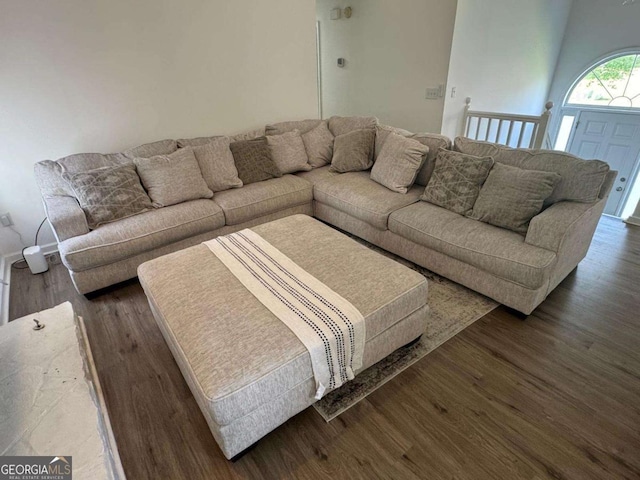 living room featuring dark wood-style flooring