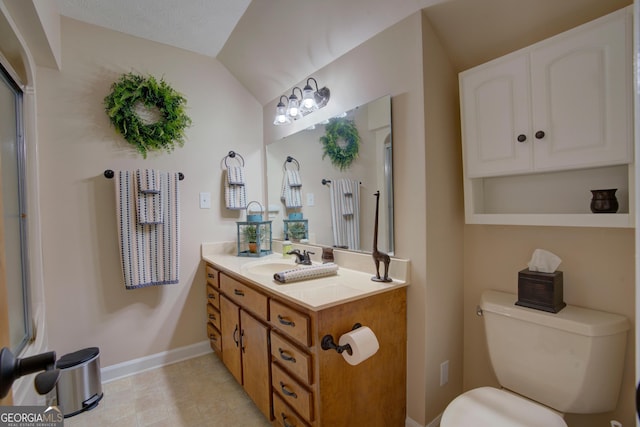 full bathroom featuring vanity, baseboards, tile patterned flooring, toilet, and lofted ceiling