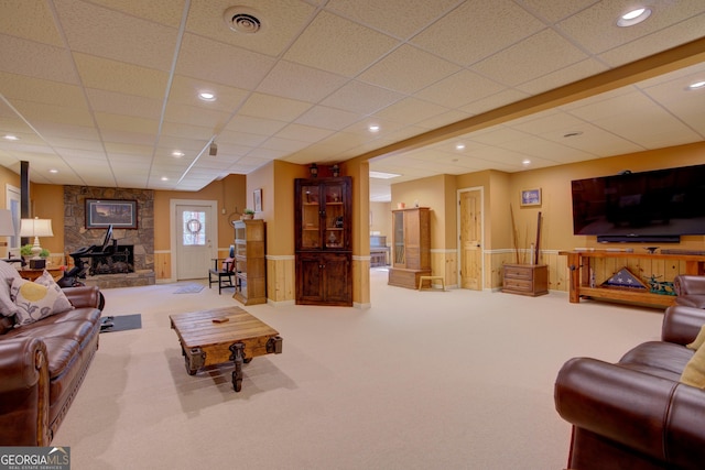 carpeted living area with visible vents, recessed lighting, and a paneled ceiling