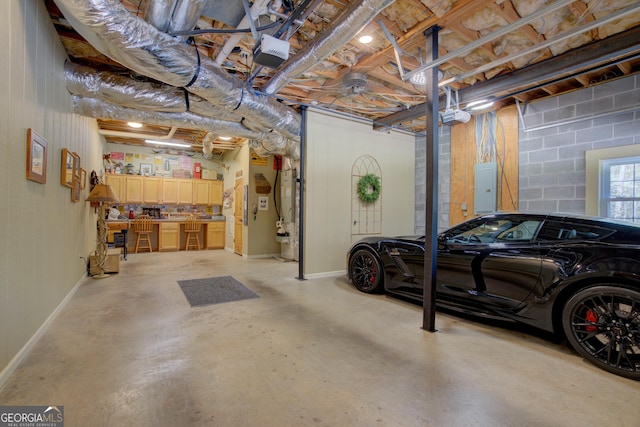 garage with a garage door opener, baseboards, electric panel, and concrete block wall