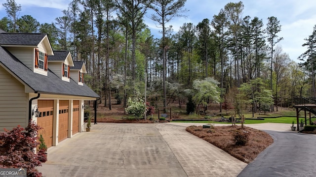view of road with driveway