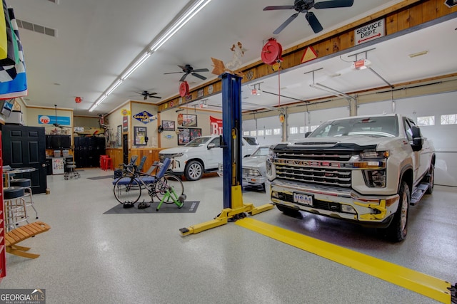 garage featuring a ceiling fan and visible vents