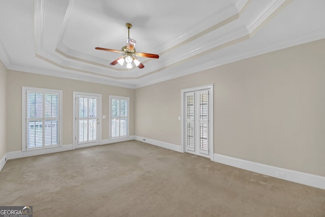 1405 Wilmington Way, Grayson, GA 30017 - unfurnished room featuring a raised ceiling, crown molding, light colored carpet, and ceiling fan
