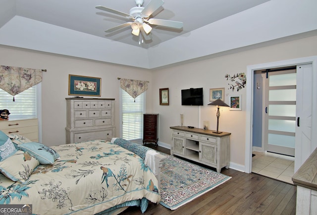 707 Tall Oak Trl, Seneca, SC 29678 - bedroom featuring a tray ceiling, baseboards, ceiling fan, and wood finished floors