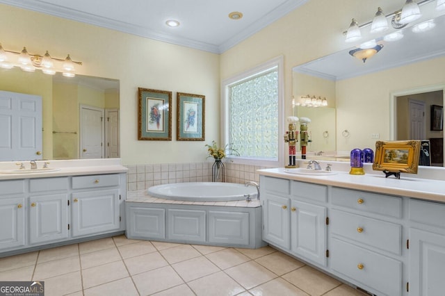 bathroom featuring crown molding, a garden tub, tile patterned flooring, and vanity