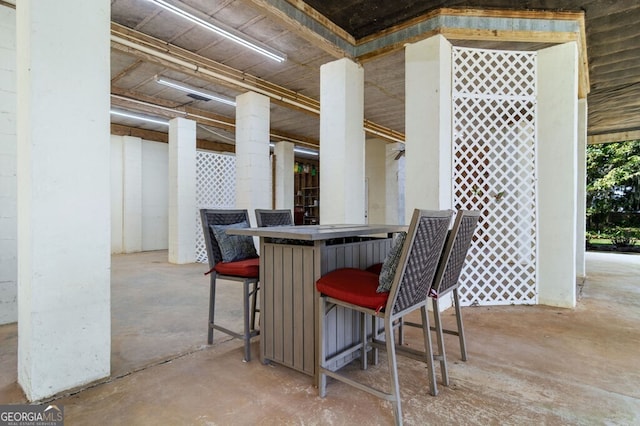 dining room with unfinished concrete flooring