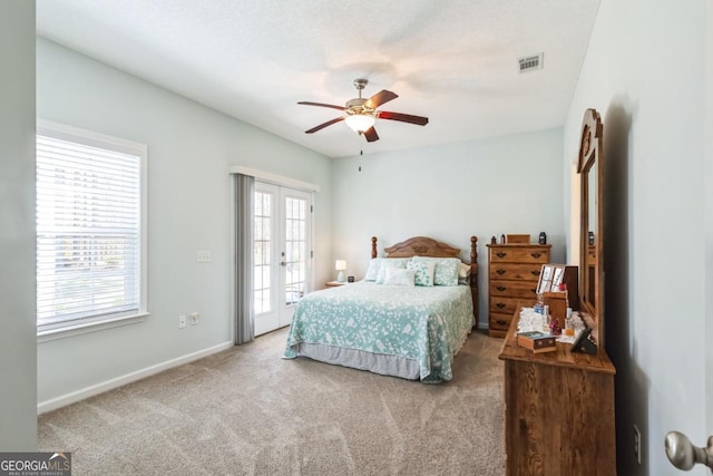 bedroom with access to outside, french doors, carpet floors, visible vents, and ceiling fan
