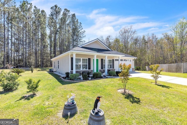 view of front of home with a front yard, central AC unit, a garage, fence, and concrete driveway