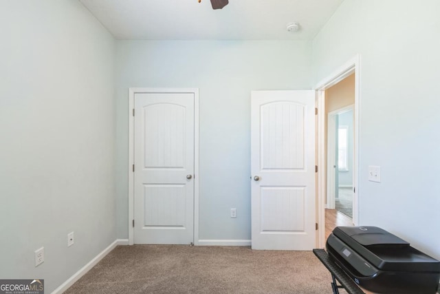 carpeted bedroom featuring baseboards