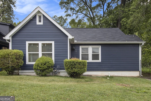 609 Spring St, Atlanta, GA 30354 - view of front facade featuring a front yard and a shingled roof
