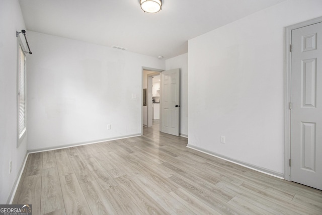 609 Spring St, Atlanta, GA 30354 - unfurnished bedroom with light wood-type flooring and baseboards