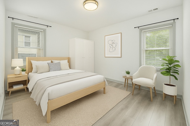 609 Spring St, Atlanta, GA 30354 - bedroom featuring light wood-style flooring and baseboards