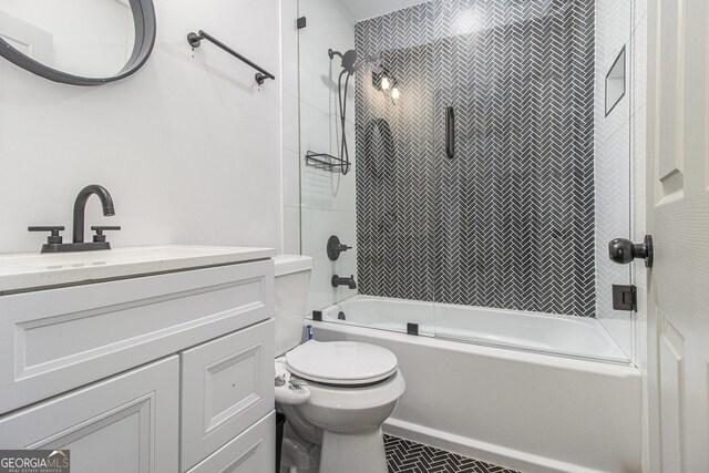 609 Spring St, Atlanta, GA 30354 - bathroom with bath / shower combo with glass door, toilet, and vanity