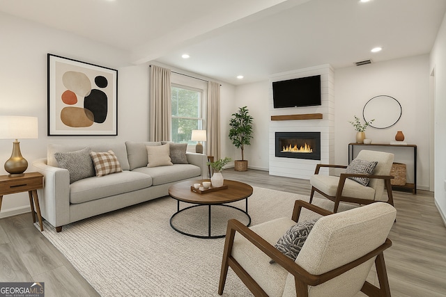 609 Spring St, Atlanta, GA 30354 - living area featuring a large fireplace, light wood-type flooring, baseboards, and recessed lighting