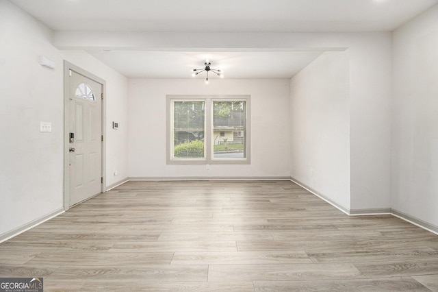 609 Spring St, Atlanta, GA 30354 - unfurnished dining area featuring plenty of natural light, light wood-style floors, baseboards, and a chandelier