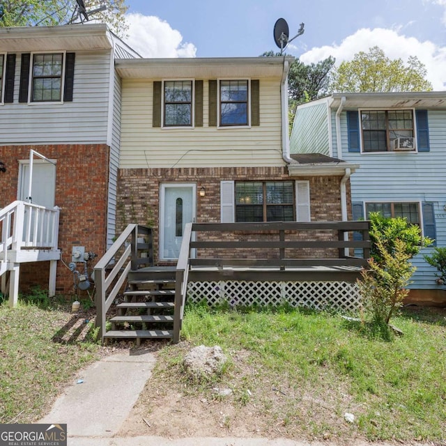 townhome / multi-family property with brick siding