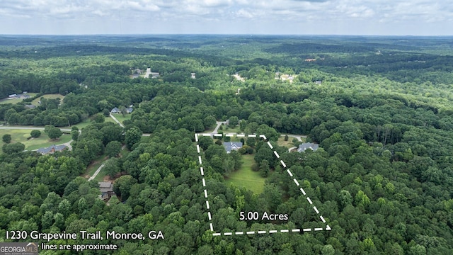 aerial view featuring a view of trees