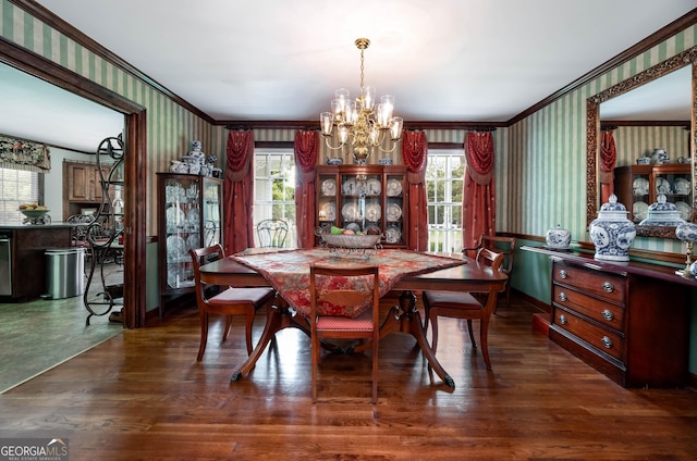 dining area with wallpapered walls, a notable chandelier, and ornamental molding