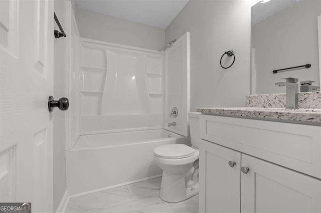 full bath with toilet, vanity, marble finish floor, and bathtub / shower combination