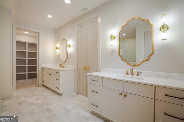 310 Arbor Garden Cir, Newnan, GA 30265 - bathroom with two vanities, recessed lighting, and tile patterned floors