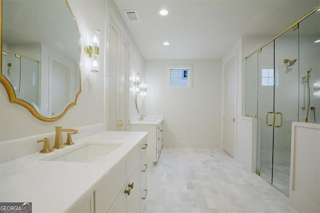 310 Arbor Garden Cir, Newnan, GA 30265 - bathroom featuring two vanities, a stall shower, and recessed lighting