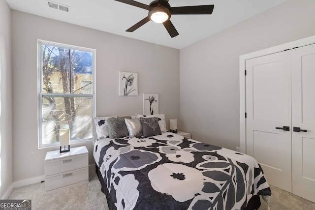 6960 Dockbridge Way, Stone Mountain, GA 30087 - bedroom featuring light carpet, a closet, and ceiling fan