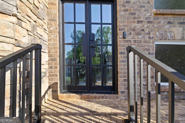6960 Dockbridge Way, Stone Mountain, GA 30087 - doorway to property featuring french doors and brick siding