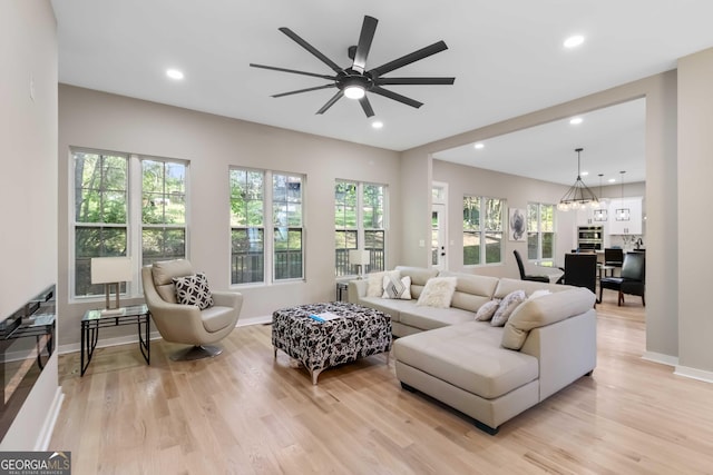 6960 Dockbridge Way, Stone Mountain, GA 30087 - living room featuring plenty of natural light, light wood finished floors, ceiling fan, and recessed lighting