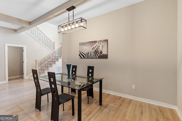 6960 Dockbridge Way, Stone Mountain, GA 30087 - dining room featuring light wood-style flooring and stairs