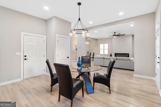 6960 Dockbridge Way, Stone Mountain, GA 30087 - dining space featuring light wood-style flooring, a ceiling fan, recessed lighting, and a chandelier