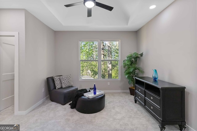 6960 Dockbridge Way, Stone Mountain, GA 30087 - sitting room with ceiling fan, a tray ceiling, and light carpet