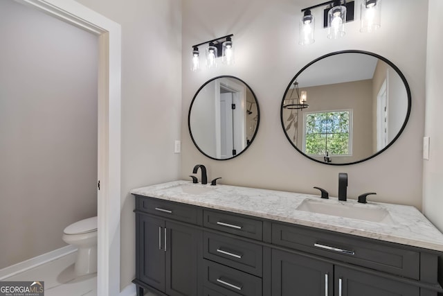 6960 Dockbridge Way, Stone Mountain, GA 30087 - bathroom featuring double vanity and toilet