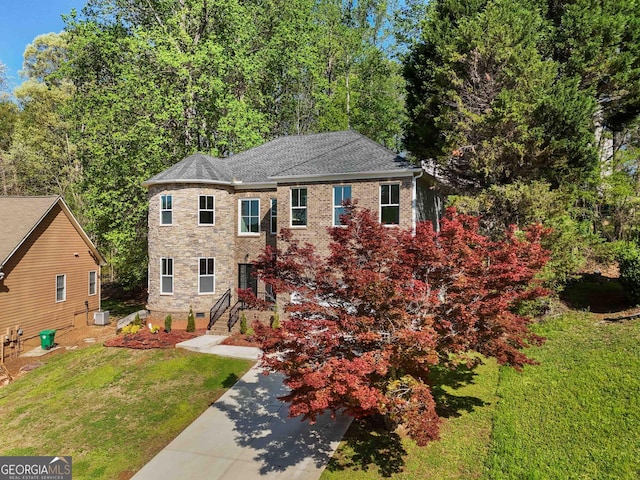 6960 Dockbridge Way, Stone Mountain, GA 30087 - view of front of property with a front yard, driveway, and stone siding