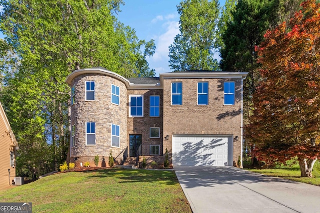 6960 Dockbridge Way, Stone Mountain, GA 30087 - traditional-style home featuring concrete driveway, a front yard, and a garage