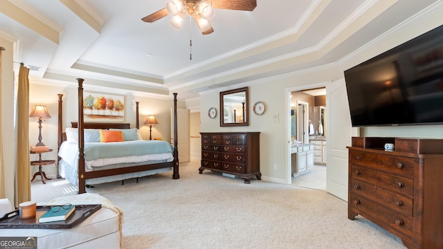 bedroom featuring crown molding, a raised ceiling, and carpet
