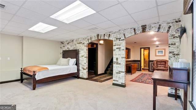 104 Kremer Falls Trce, Canton, GA 30114 - carpeted bedroom featuring a paneled ceiling, arched walkways, and decorative columns