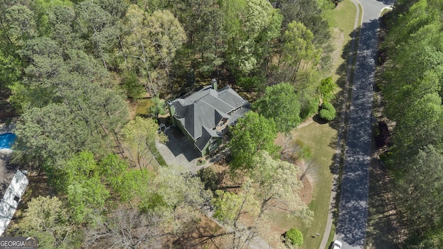 aerial view with a wooded view